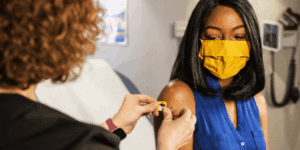 woman getting covid-19 vaccine