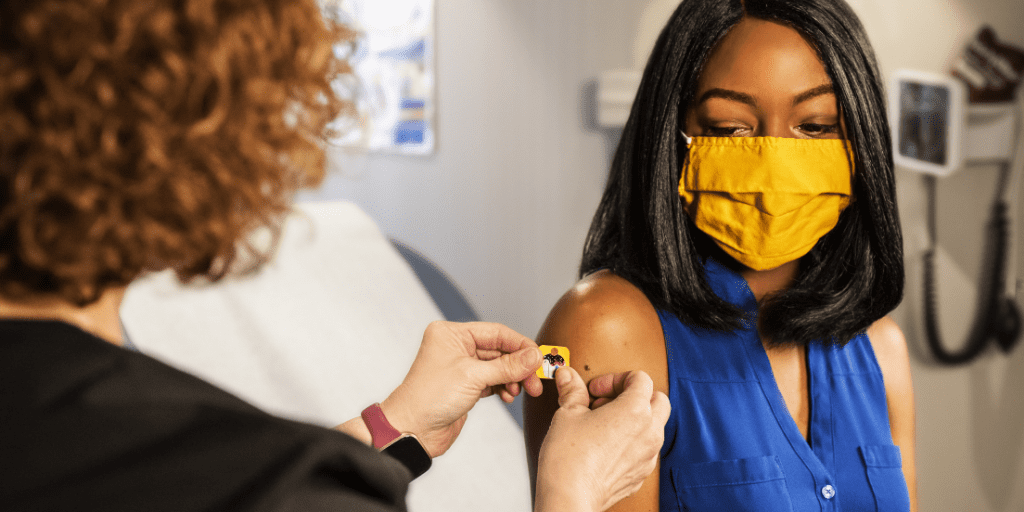 woman getting covid-19 vaccine